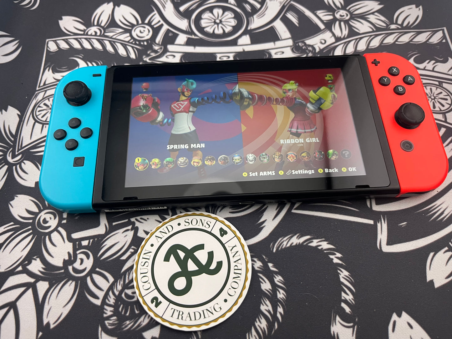 Nintendo Switch Red and Blue Joy Cons with Arms and Pro Controller