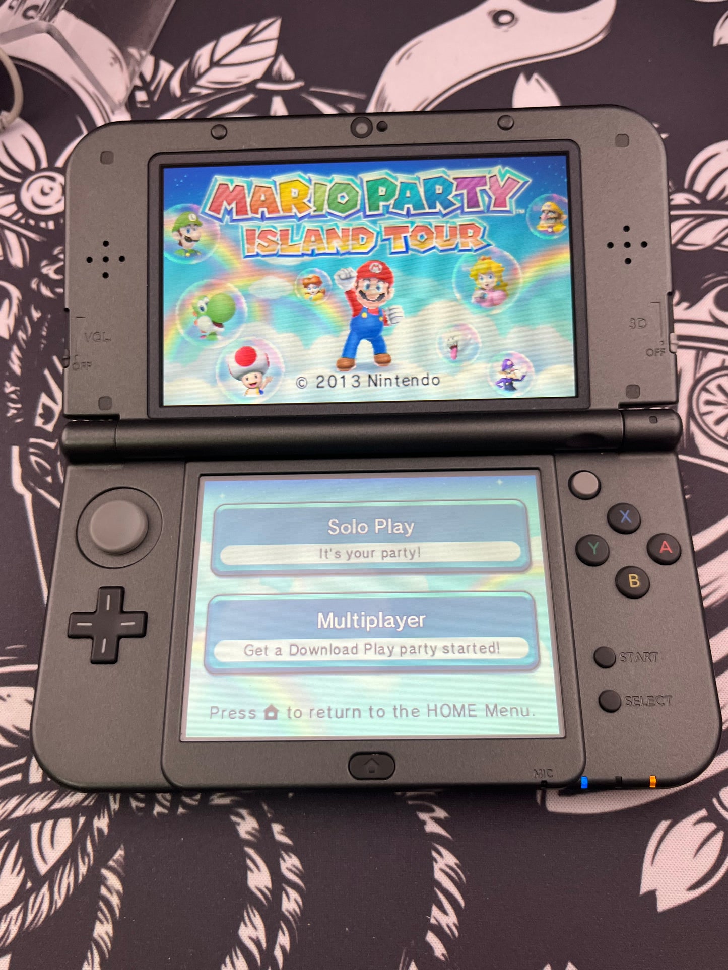 “New” Nintendo 3DS XL black plus mario party 3ds