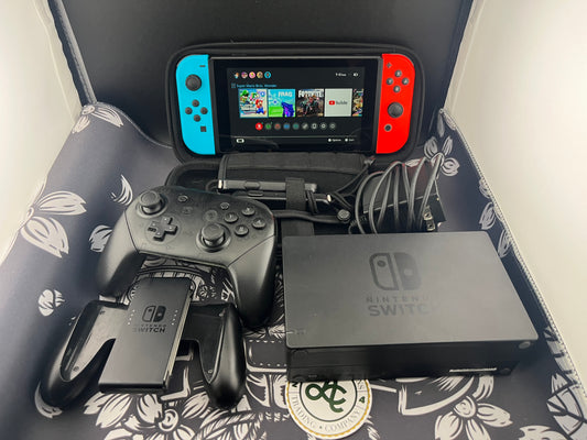 Nintendo Switch Red and Blue Joy Cons with Arms and Pro Controller